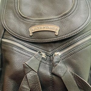 B. Makowsky black leather backpack.